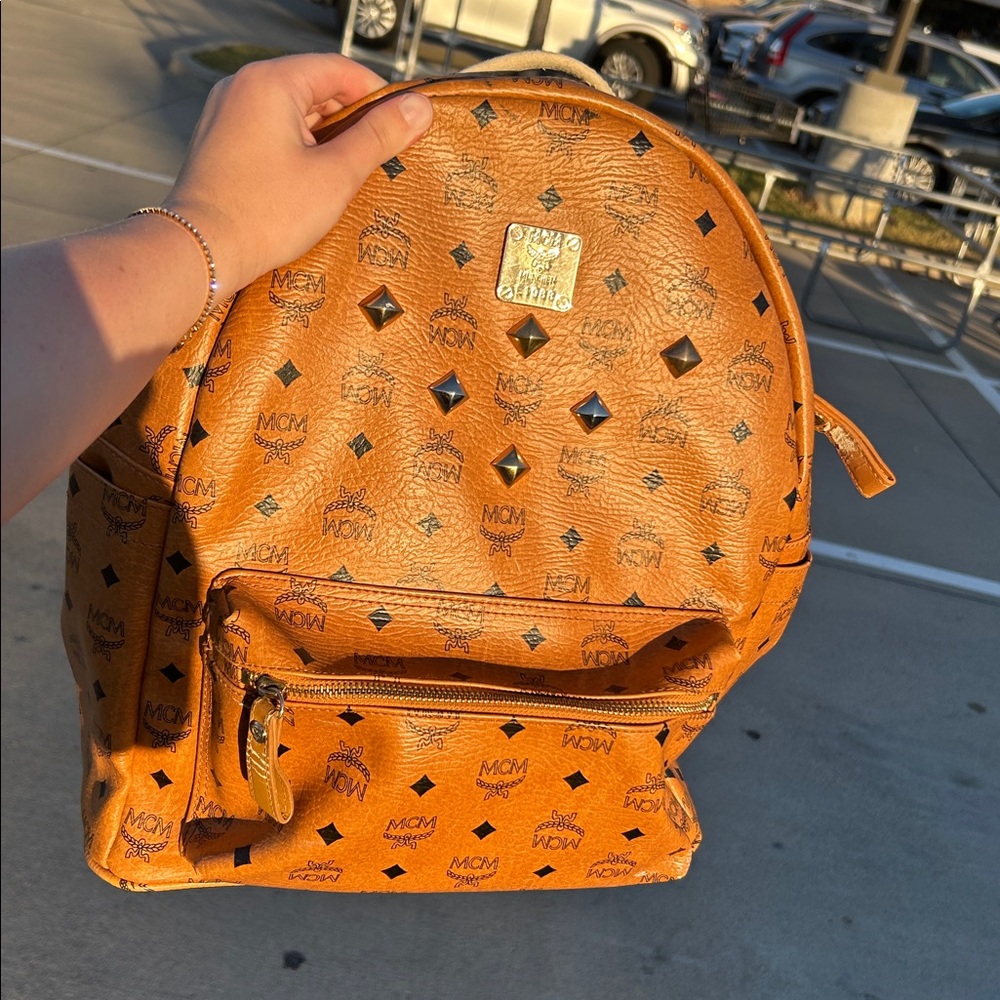 Authentic MCM Cognac Backpack with Gold and Black Details